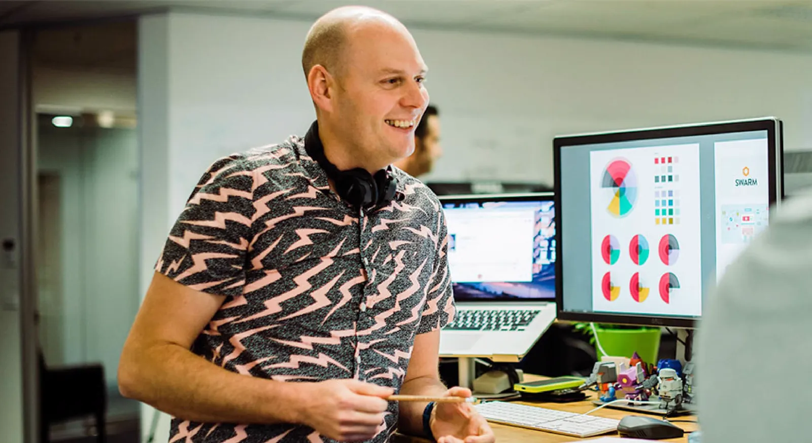 Leigh designing at his desk